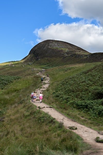 Image of hikers on a trail path